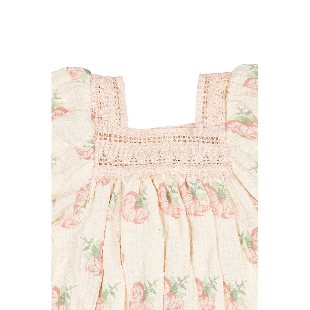 Floral baby romper on a white background
