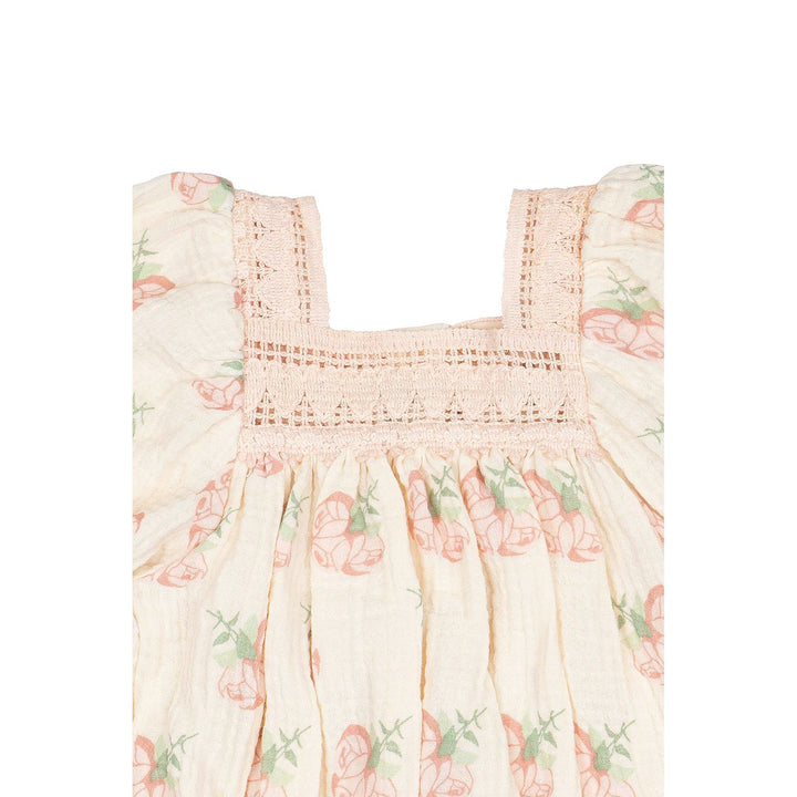 Floral baby romper on a white background