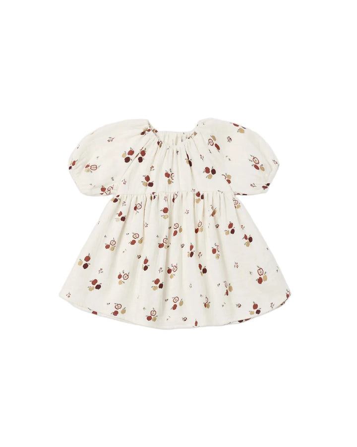 Organic Quincy Mae Bella Dress in an apple print on a natural background. Short puff sleeves full gathered skirt.