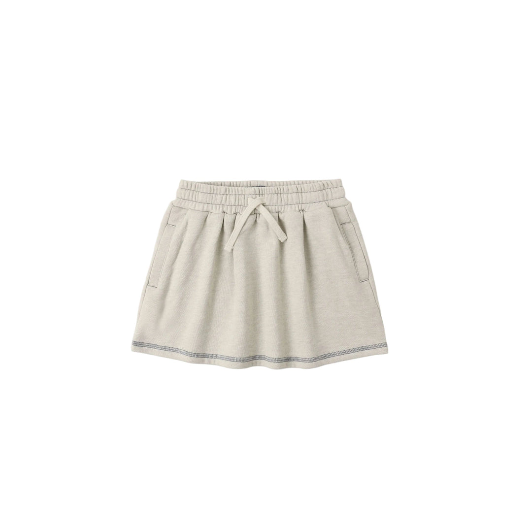 Beige children's athletic skirt with an elastic waistband on a white background