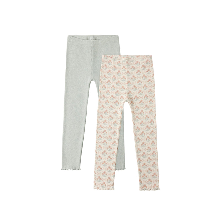 Two pairs of leggings, one gray and one with a floral pattern, on a white background.