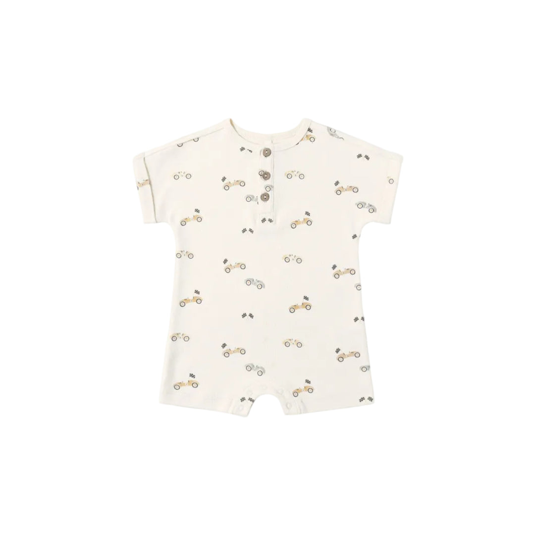 Baby romper with cherry pattern on a white background