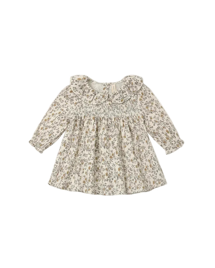 Our Callie Dress is a timeless, feminine style featuring a darling eyelet collar, a smocked front bodice, a softly gathered skirt, and delicate ruffle sleeves. Buttons at the back allow for easy dressing, and matching bloomers