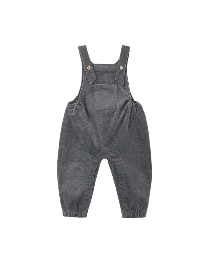 Organic baby overalls in midnight blue designed with adjustable straps and coconut button closures, an open bib pocket, and elastic sides for a comfortable fit.