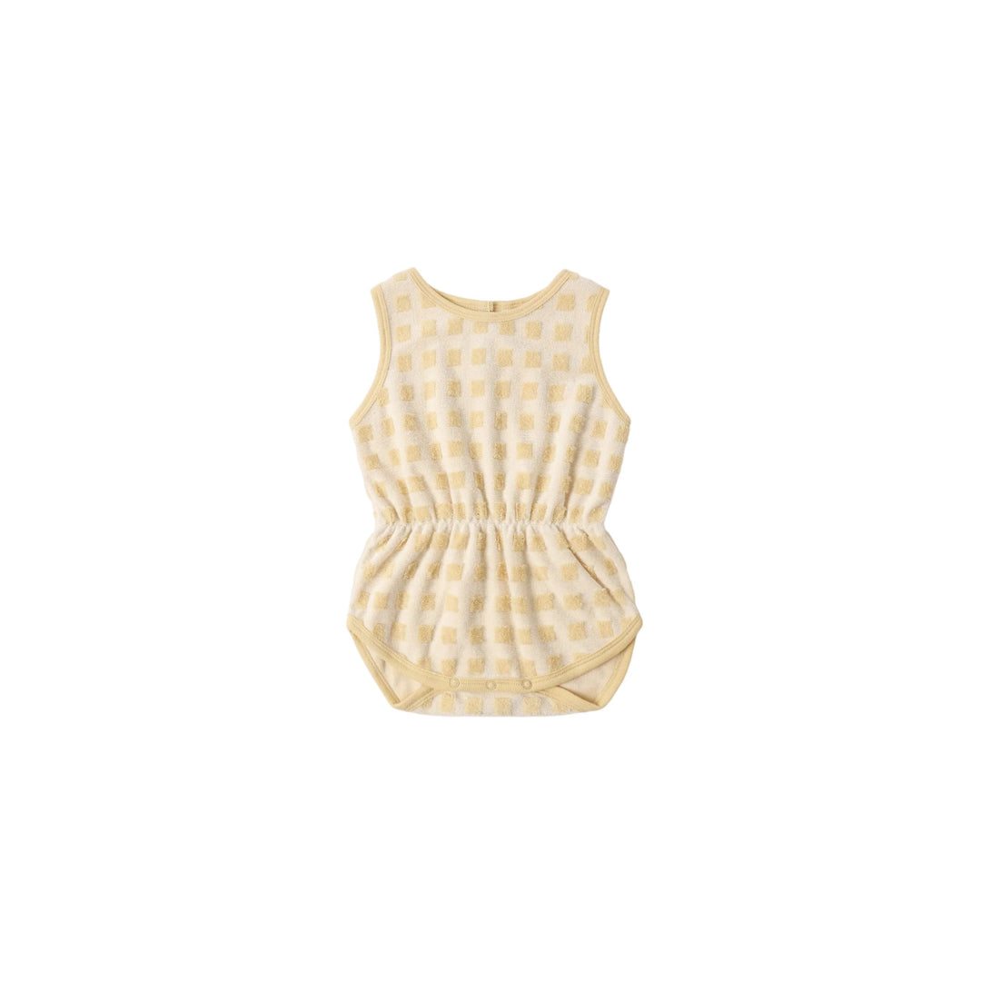 Yellow checkered romper on a white background