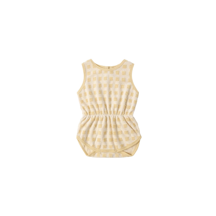 Yellow checkered romper on a white background