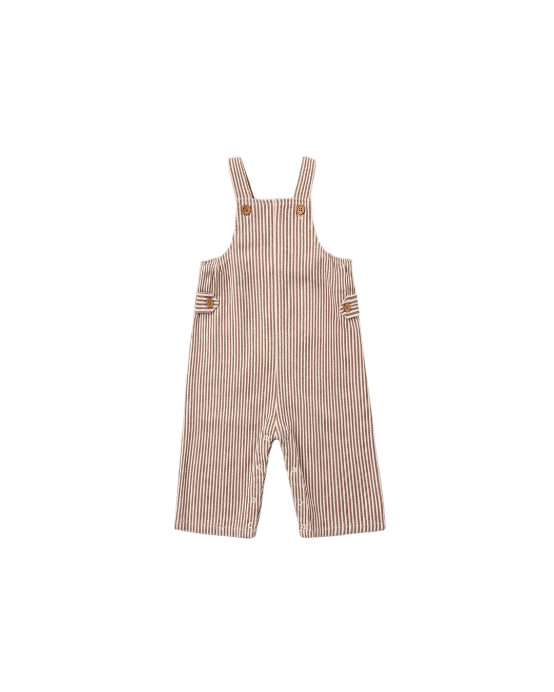 A baby romper in a pinkish-beige and white vertical stripe pattern, featuring adjustable shoulder straps with brown buttons and side pockets, shown flat on a light gray background.