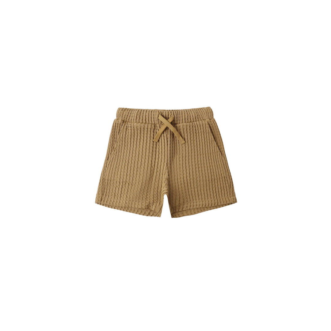 Beige shorts with a drawstring on a white background
