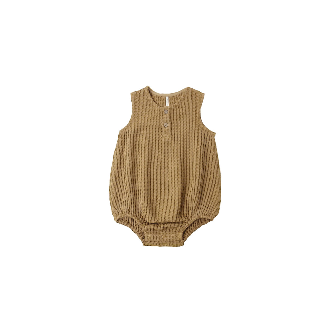 Brown ribbed baby romper on a white background