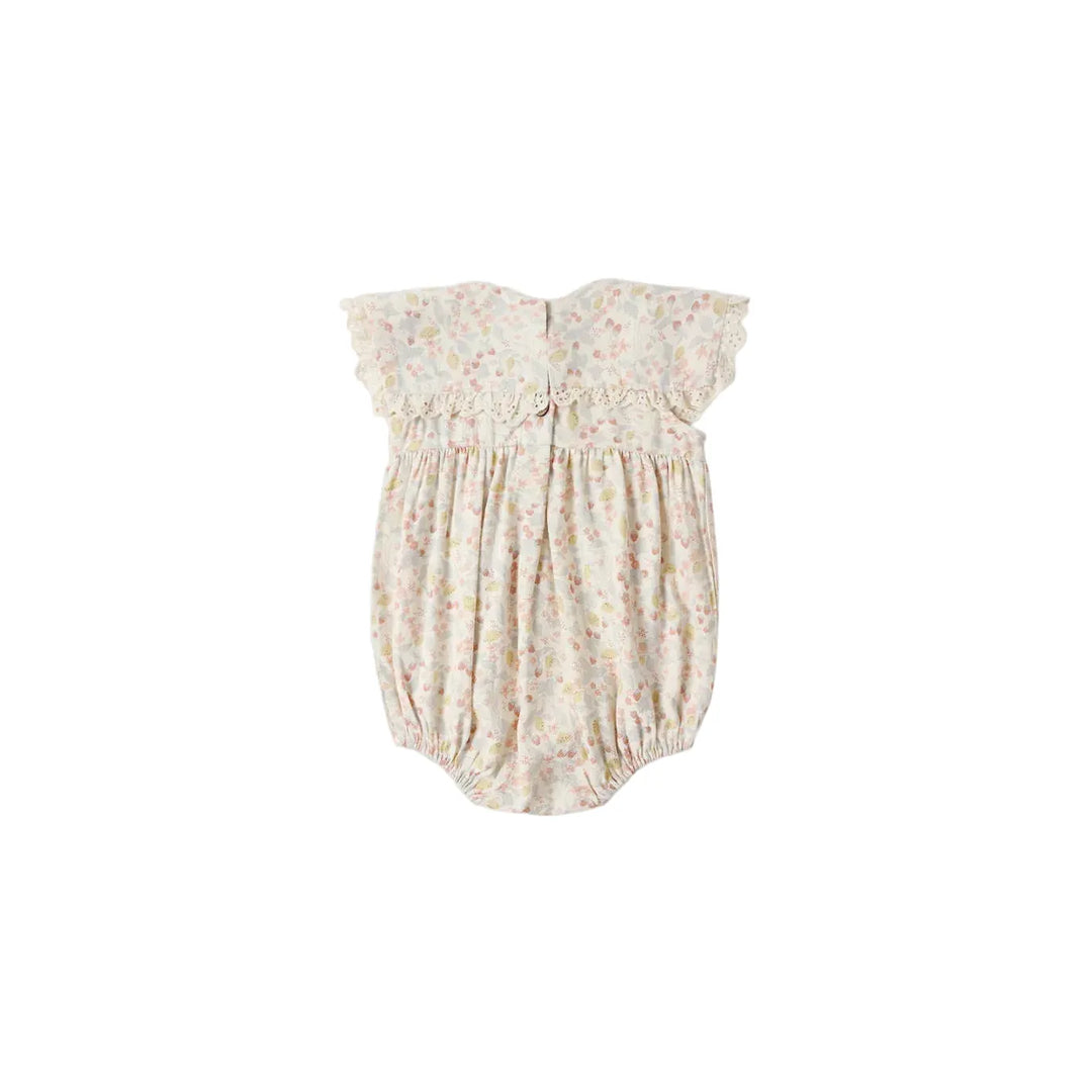 Floral baby romper on a white background