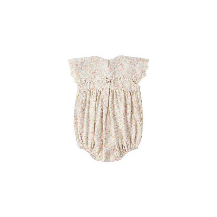 Floral baby romper on a white background