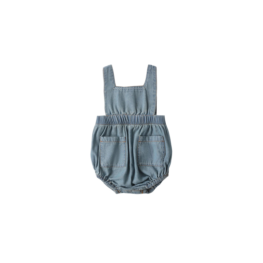 Denim baby romper on a white background