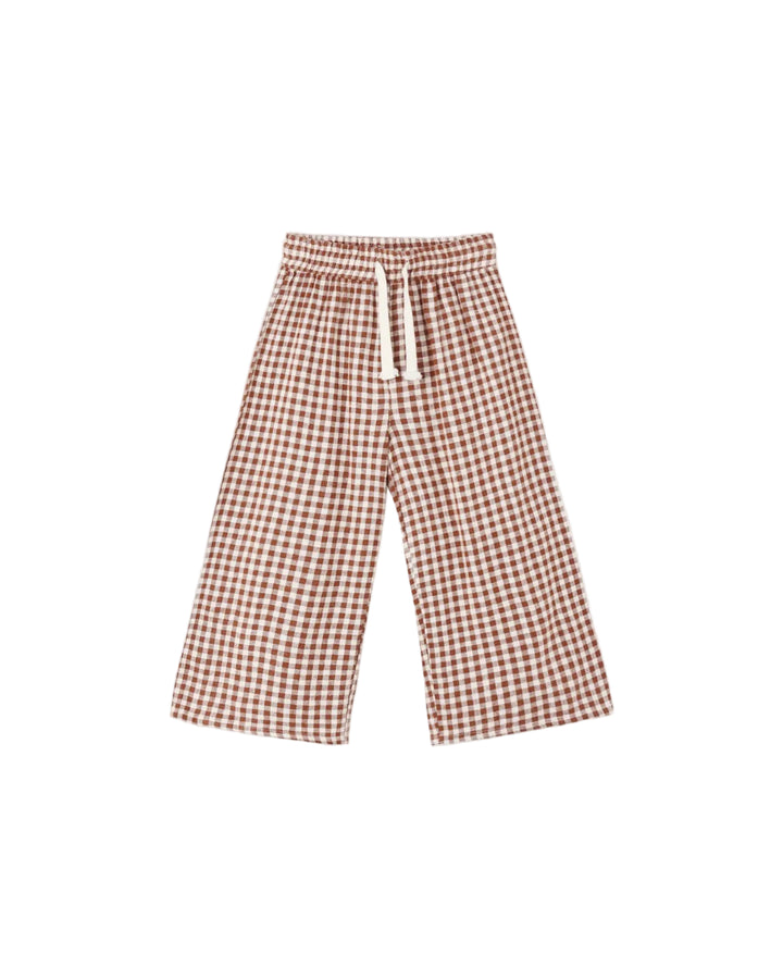A pair of wide-leg cropped pants featuring a brown and white gingham check pattern, a matching elastic waistband, and a white drawstring, displayed against a solid light gray background.