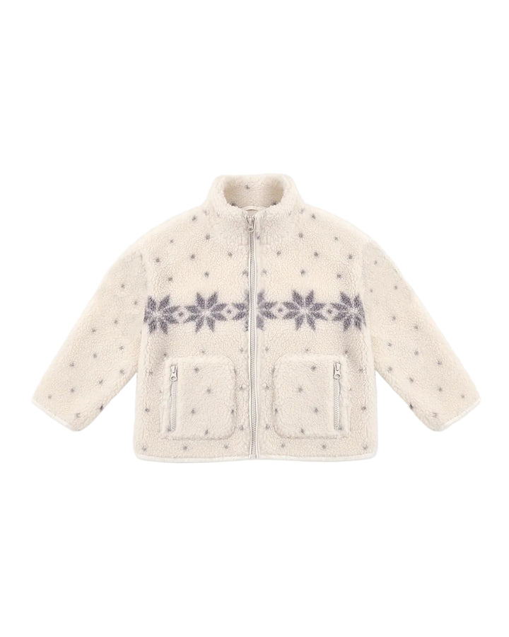 A cream-colored sherpa fleece jacket with a gray snowflake pattern across the chest and small gray star prints throughout, featuring a front zipper and two zippered pockets.