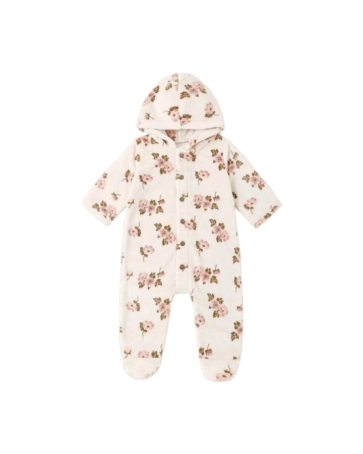 A baby hooded footed sleeper in a warm cream color with an all-over pink and brown floral print, shown flat on a light gray background.
