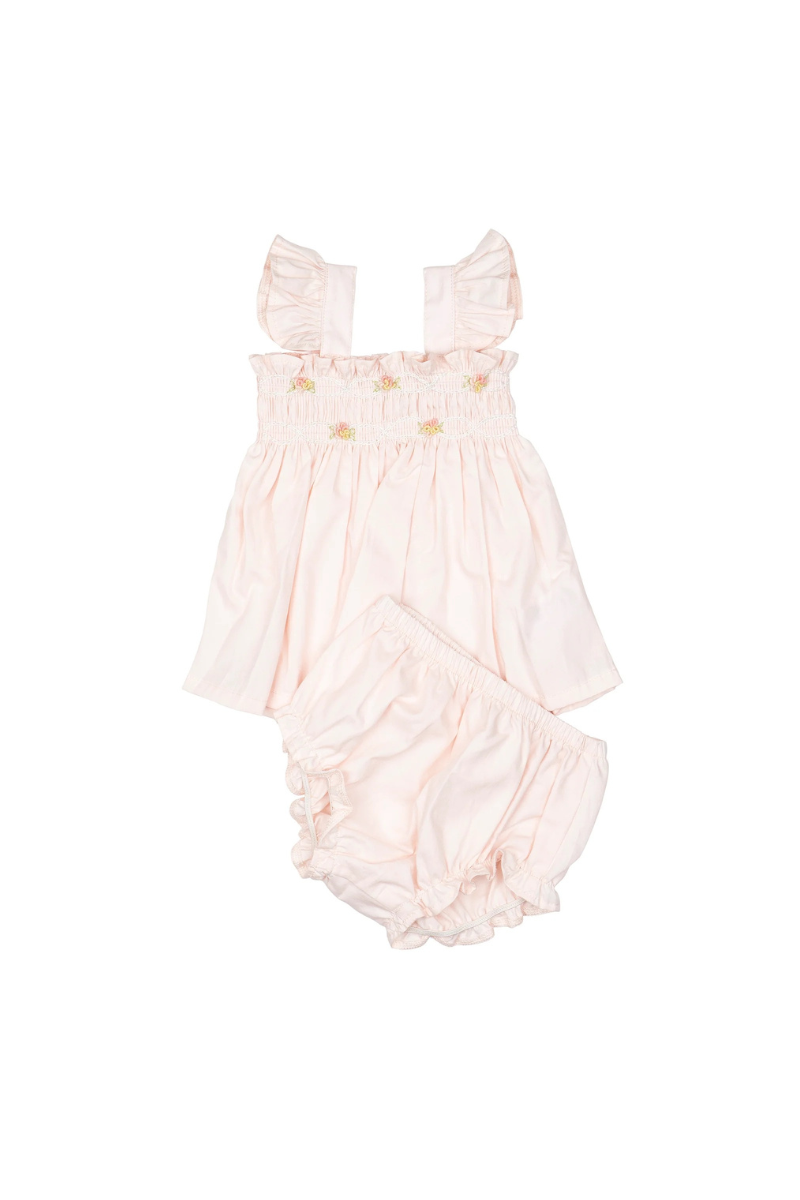 Hand-smocked flutter tunic with embroidered details and matching bloomers in soft pink on a white background.