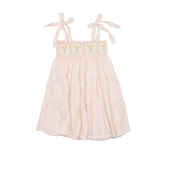 soft pink dress with floral embroidery on a white background
