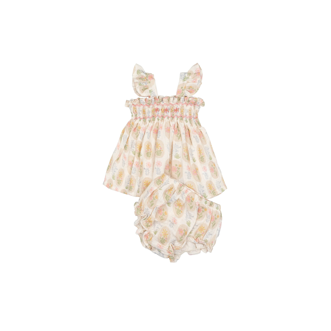 Hand-smocked flutter tunic and bloomers set in Early Blooms floral print on a white background.