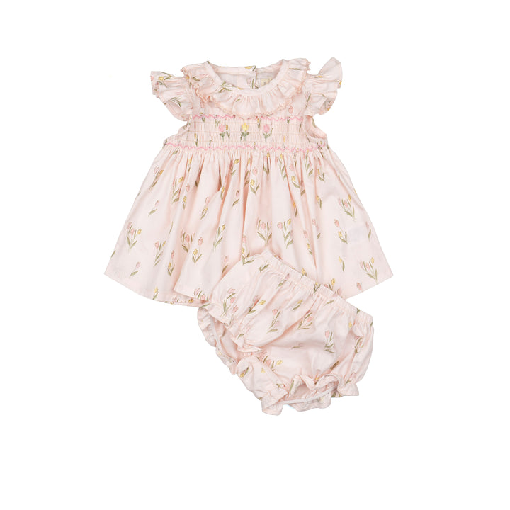 Baby dress and bloomers set with floral pattern on a white background