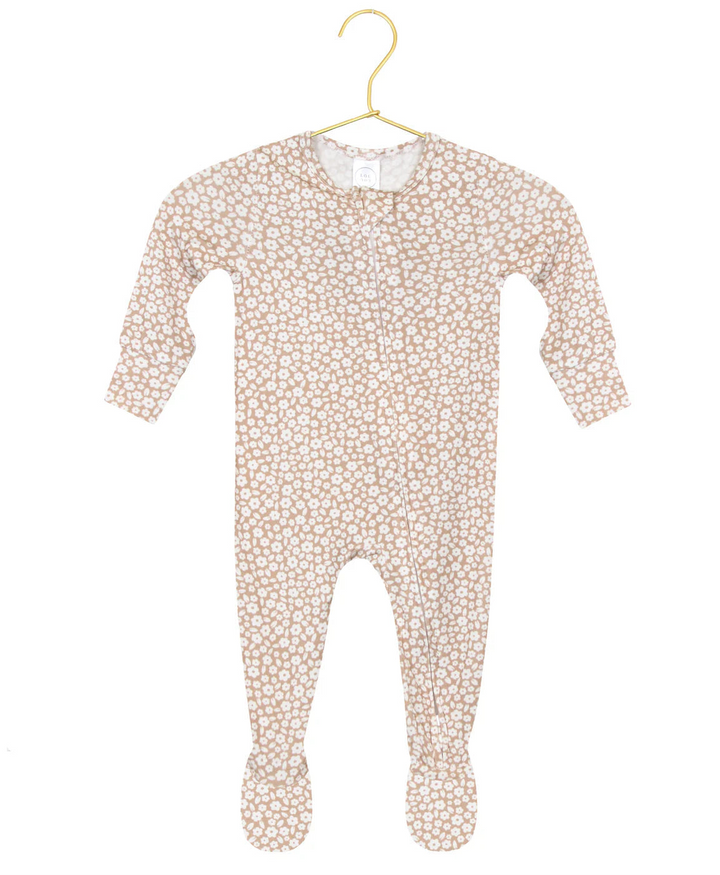 Baby onesie with floral pattern on a hanger against a white background