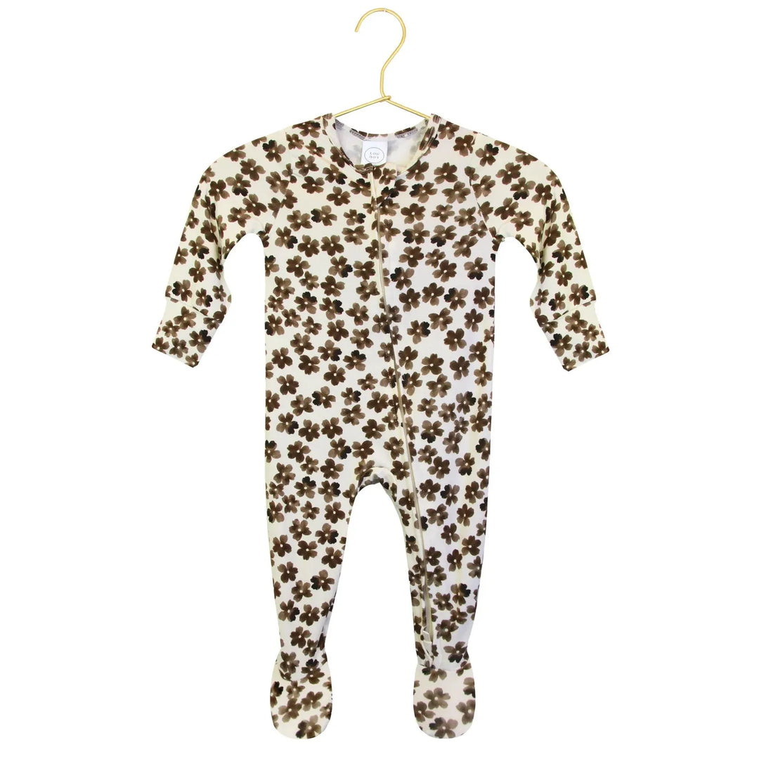 Floral-patterned baby onesie on a hanger with a close-up of the pattern.