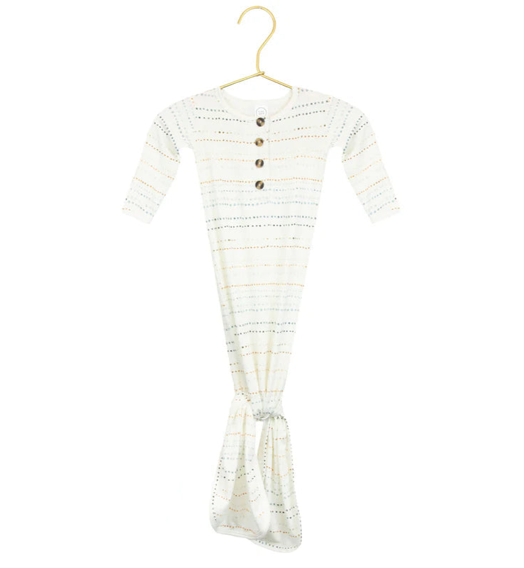 A knotted gown for babies with long sleeves, featuring rainbow dots pattern and button-down front, displayed on a hanger.